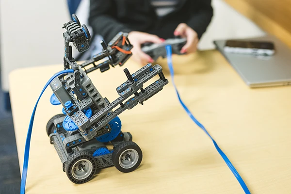 FIU CEC student working on robotic device